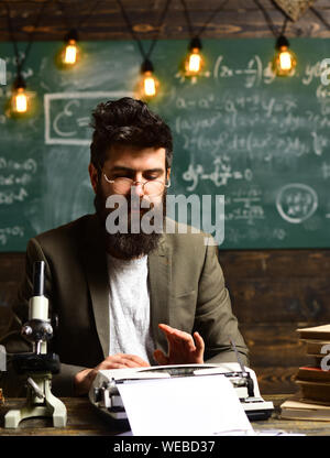 Talented coach during workshop indoors - productive training in stylish college interior, University seminar conference team collaboration concept, Te Stock Photo