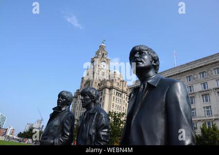 Statue of The Beatles by Andrew Edwards in front of Liver Building on Liverpool waterfront, England, UK Stock Photo