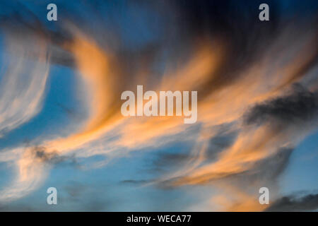 Dramatic sunset with clouds and sun rays over Caribbean sea - colorful sunset light rays - clouds and sun rays | sun rays - Caribbean Sunset Stock Photo