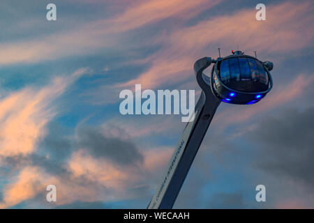 Royal Caribbean North Star Athem of the Seas observation pod in the clouds during a colorful sunset - Caribbean Sunset with feathery cirrus clouds Stock Photo