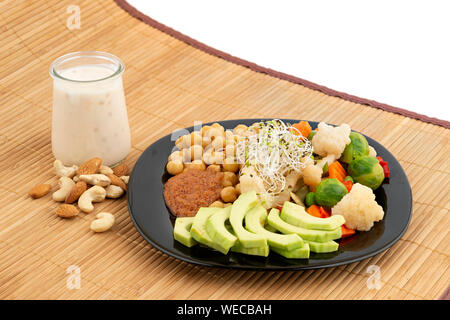 Vegetables, chickpeas, yogurt and nuts – healthy food concept Stock Photo