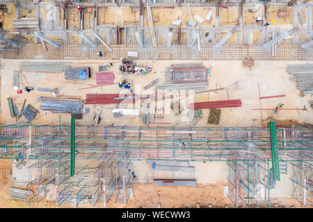 Aerial view of group of construction worker building in construction site. Stock Photo