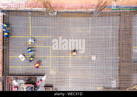 Aerial view of group of construction worker building in construction site. Stock Photo