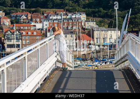 Woman standing on tip toes hi-res stock photography and images - Alamy