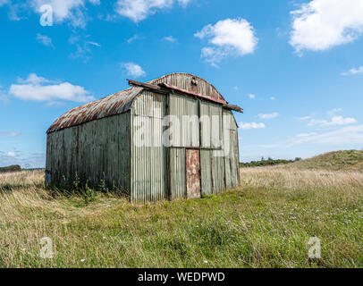 Corrugated iron hanger on Westbury Beacon Butterfly Conservation reserve on the Mendips in Somerset, part of ROC cold war era nuclear monitoring post Stock Photo