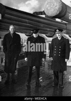 Winston Churchill aboard a warship with Sir Stafford Cripps and Commander of the Home Fleet, Admiral Tovey. 3rd October 1942 Stock Photo