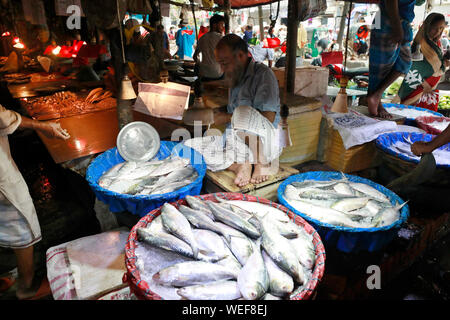 Dhaka, Bangladesh - August 29, 2019: Bangladeshi vendors wait for customer at Hatirpool kitchen market in Dhaka, Bangladesh, August 29, 2019. Stock Photo