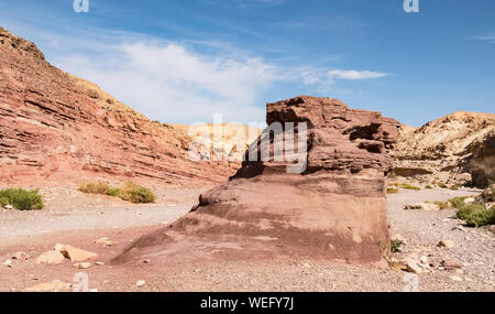 a giant sandstone boulder sits in the middle of wadi shani at the western entrance to the red canyon in  the eilat mountains in israel Stock Photo