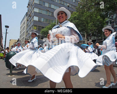 The cast of the group Huamanga Tunante dances in a parade, in Lima, to promote and launch the next Carnival Ayacucho 2018, which will take place in the city of Huamanga from February 10th to 14th. Stock Photo