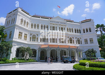 SINGAPORE -23 AUG 2019- View of landmark colonial style Raffles Hotel, a famous luxury hotel in the Civic District in Singapore opened in 1887 and reo Stock Photo