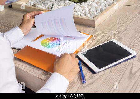 Businessman checking financial documents in the office Stock Photo