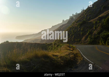 the pacific coast highway fading into the misty cliffs Stock Photo
