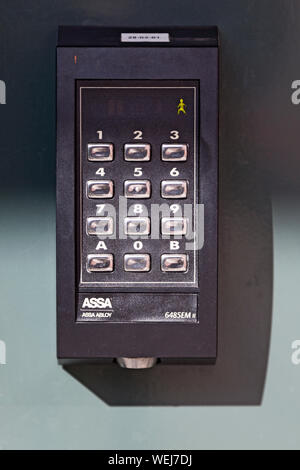 Umea, Sweden - August 10, 2019: advanced code lock with numbers and plastic tag Stock Photo