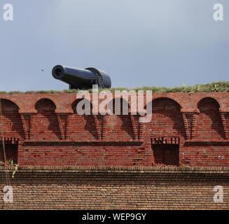 Cannon pointing to the ocean at the top of Fort Jefferson at the Dry Tortugas National Park in Florida. Stock Photo