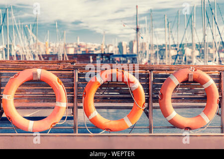 red life-saving floats on the deck of a ship outdoors Stock Photo