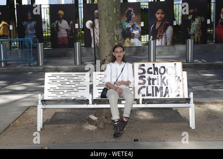 New York, New York, USA. 30th Aug, 2019. ALEXANDRIA VILLESENOR, 14, of New York sits on a bench in front of the United Nations, with a ''School Strike Climate'' poster in New York, New York. VILLESENOR an 8th grader has conducted 38 straight Friday strikes since December 14, 2018. Villensenor joined over two hundred climate strikers and activists including 16 year old Swedish climate justice activist Greta Thunberg in a city wide strike and demonstration. Credit: Brian Branch Price/ZUMA Wire/Alamy Live News Stock Photo