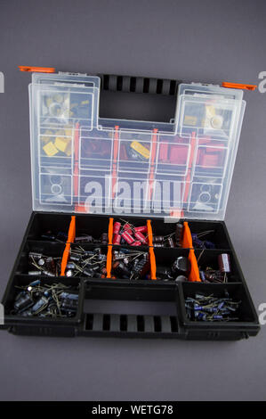 Electronic components capacitors stacked in a plastic folding case Stock Photo