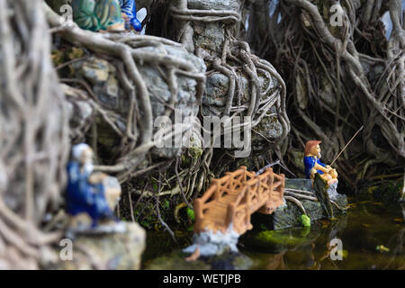 Miniature Fisherman Figurines in Bonsai Tree, Bai Dinh Temple Spiritual and Cultural Complex, Ninh Binh Province, Vietnam, Asia Stock Photo