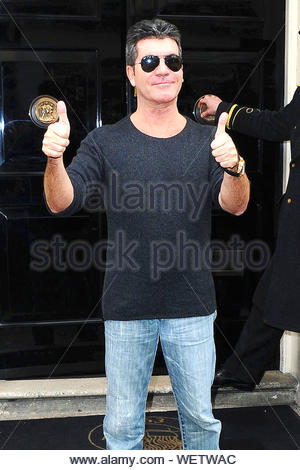 Simon Cowell gives a thumbs up on the set of X Factor Stock Photo ...