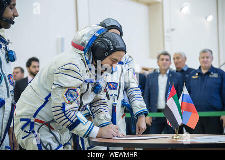 Star City, Russia. 30 August 2019. International Space Station Expedition 61 cosmonaut Russian Oleg Skripochka of Roscosmos in his Sokol space suit signs in for final crew qualification exams at the Gagarin Cosmonaut Training Center August 30, 2019 in Star City, Russia. Credit: NASA/Planetpix/Alamy Live News Stock Photo