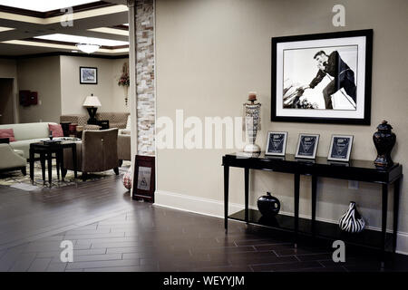 The Lobby of the La Quinta Inn & Suites by Wyndham, with Elvis Presley photographs in Tupelo, MS, USA Stock Photo