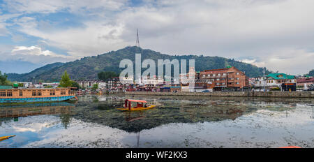A view of Dal Lake in Srinagar with a mountain in the background. Stock Photo