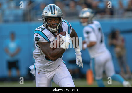 Carolina Panthers running back Cameron Artis-Payne (34) crosses the goal  line against New Orleans Saints cornerback Marshon Lattimore (23) on a  tcoudhown carry in the first half of an NFL football game