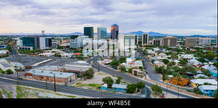 Golden light reflects off the buildings in the downtown city center of Tucson Arizona Stock Photo