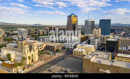 Golden light reflects off the buildings in the downtown city center of Tucson Arizona Stock Photo