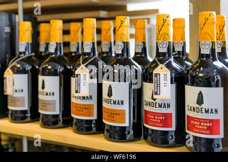 Porto, Portugal - May 30, 2018: Bottles of traditional port wine from a famous producer Sandeman on display in Porto Portugal Stock Photo