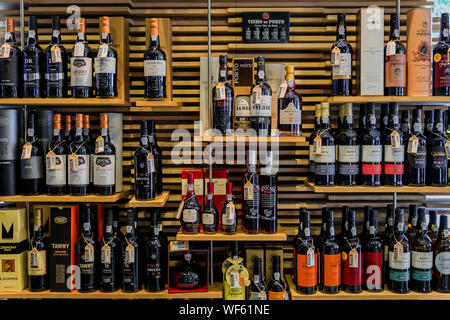 Porto, Portugal - May 30, 2018: Bottles of traditional port wine from famous producers on display in Porto Portugal Stock Photo