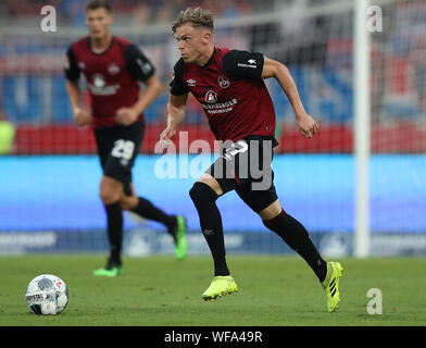 Nuremberg, Germany. 30th Aug, 2019. Soccer: 2nd Bundesliga, 1st FC Nuremberg - 1st FC Heidenheim, 5th matchday in Max Morlock Stadium. Robin Hack from Nuremberg plays the ball. Credit: Daniel Karmann/dpa - IMPORTANT NOTE: In accordance with the requirements of the DFL Deutsche Fußball Liga or the DFB Deutscher Fußball-Bund, it is prohibited to use or have used photographs taken in the stadium and/or the match in the form of sequence images and/or video-like photo sequences./dpa/Alamy Live News Stock Photo
