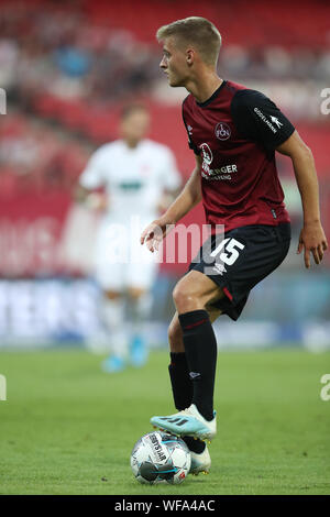 Nuremberg, Germany. 30th Aug, 2019. Soccer: 2nd Bundesliga, 1st FC Nuremberg - 1st FC Heidenheim, 5th matchday in Max Morlock Stadium. The Nuremberg Fabian Nürnberger plays the ball. Credit: Daniel Karmann/dpa - IMPORTANT NOTE: In accordance with the requirements of the DFL Deutsche Fußball Liga or the DFB Deutscher Fußball-Bund, it is prohibited to use or have used photographs taken in the stadium and/or the match in the form of sequence images and/or video-like photo sequences./dpa/Alamy Live News Stock Photo