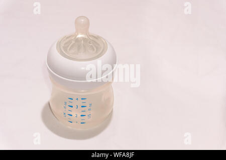 Download A High Angle Shot Of A Baby Bottle And Milk With A Yellow Green Color In The Background Stock Photo Alamy PSD Mockup Templates