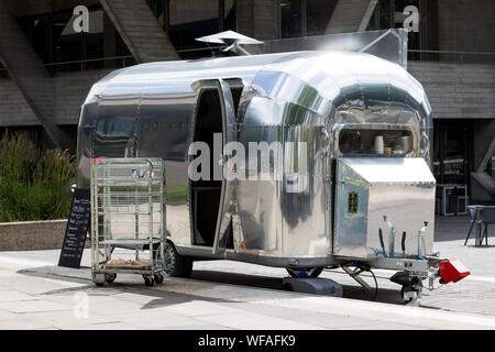 London, UK - 5 June 2017: Iconic Airstream Travel Trailer being used as a food truck on the South Bank of the Thames river in London, UK Stock Photo