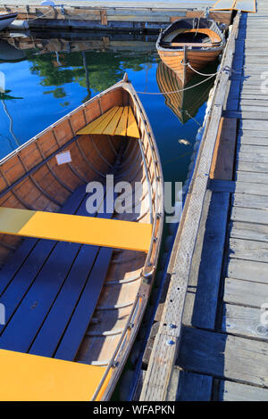 Boats Parked On Wooden Dock On Lake Stock Photo - Alamy