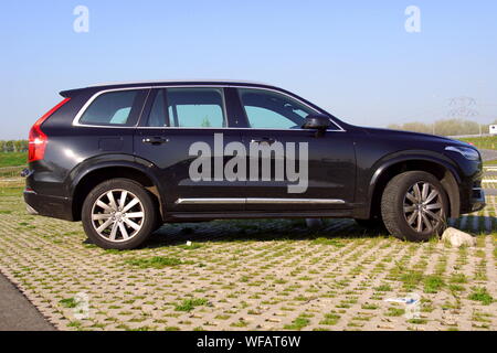 Almere, Flevoland, The Netherlands - March 17, 2018: Black Volvo XC90 SUV parked on parked on a public parking lot. Nobody in de vehicle. Stock Photo