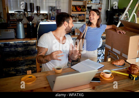 man and smiling woman as business partners. Young business owner working Stock Photo