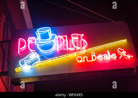 Illuminated neon signs advertise Peoples on Beale St music club on Beale Street, Memphis, Tennessee, United States Stock Photo