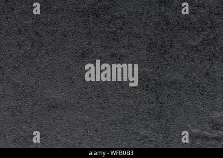 Strict synthetic stone background in dark grey tone. Stock Photo