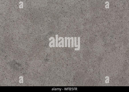 Texture new wall of of small artificial grey stone. Stock Photo