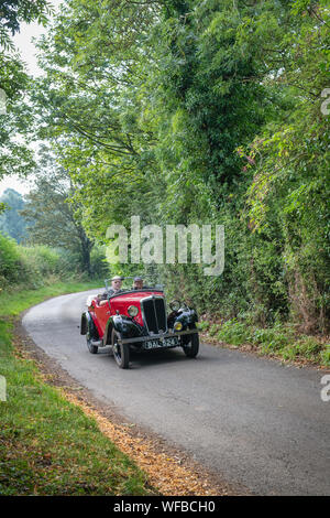 1935 Morris Eight going to a classic car show in the Oxfordshire countryside. Broughton, Banbury, England Stock Photo