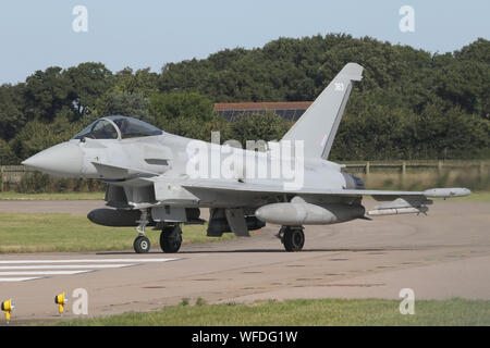 RAF Typhoon taxiing onto the runway at Coningsby prior to departing for a training sortie. Stock Photo