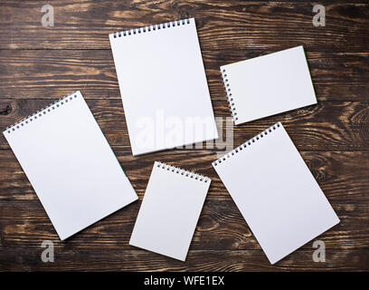 Empty open notebooks on wooden background Stock Photo