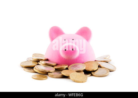 Pink piggy bank with euro coins on white background Stock Photo