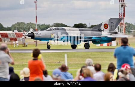 Romanian Air Force Mikoyan-Gurevich MiG-21 taking off at the 2019 Royal International Air Tattoo in front of spectators in the Cotswold Enclosure Stock Photo