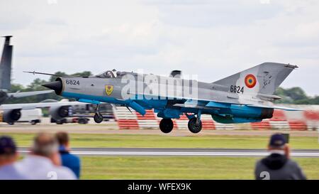 Romanian Air Force Mikoyan-Gurevich MiG-21 taking off at the 2019 Royal International Air Tattoo in front of spectators in the Cotswold Enclosure Stock Photo