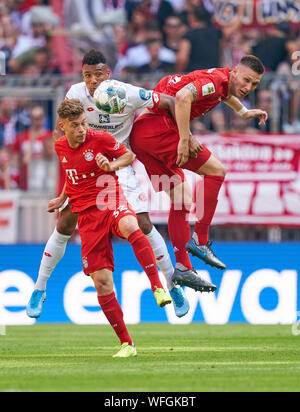 Germany. 31st August 2019. Joshua KIMMICH, FCB 32 Niklas SUELE, FCB 4  compete for the ball, tackling, duel, header, zweikampf, action, fight against Karim ONISIWO, MZ 21  FC BAYERN MUNICH - FSV MAINZ 05  - DFL REGULATIONS PROHIBIT ANY USE OF PHOTOGRAPHS as IMAGE SEQUENCES and/or QUASI-VIDEO -  1.German Soccer League , Munich, August 31, 2019  Season 2019/2020, matchday 03, FCB, München © Peter Schatz / Alamy Live News Stock Photo