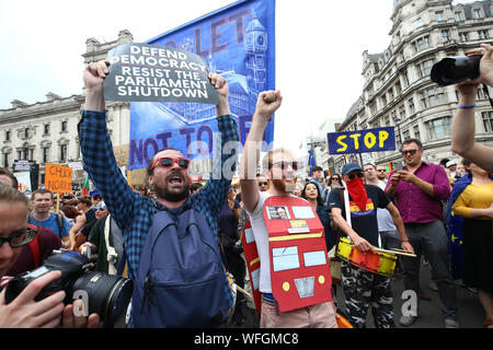 Organiser Michael Chessum addressing protesters taking part in the 'Let Us Vote' day of action, organised by Another Europe is Possible campaign group in Parliament Square in central London, to demonstrate against Prime Minister Boris Johnson's decision to suspend Parliament for up to five weeks before a Queen's Speech on October 14. Stock Photo