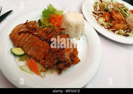 Peking duck Chop Suey with steamed rice close up Stock Photo - Alamy